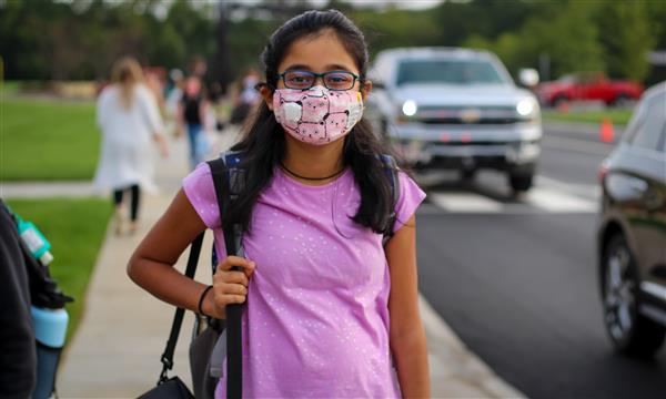 student smiles on first day of school